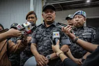 Two Indonesians held over fake immigration stamp syndicate