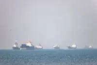 Chinese-owned oil tanker hit near Hormuz as US pauses ship-protection plan, report says