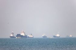 Chinese-owned oil tanker hit near Hormuz as US pauses ship-protection plan, report says