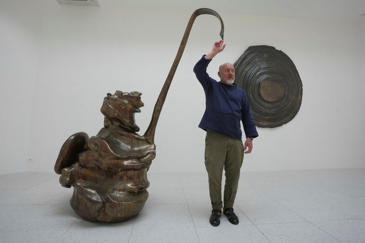 Allen makes biomorphic sculptures in wood, stone and bronze, and is reluctant to name them to give viewers 'a moment of creation when they can decide what it is.' Photo: AP