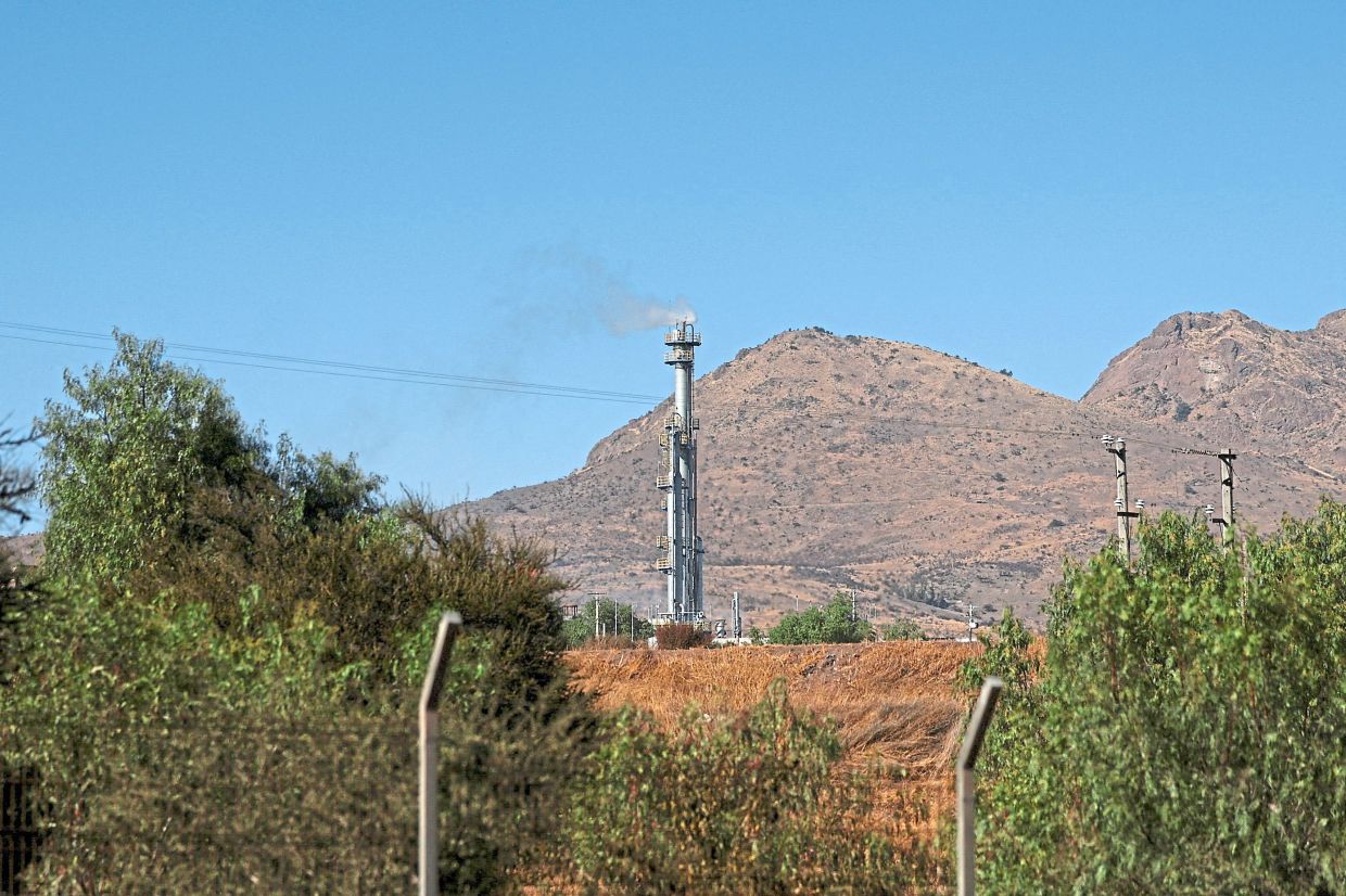 Smoke from a chimney at the landfill, which is made of domestic waste ang used to biogas production.