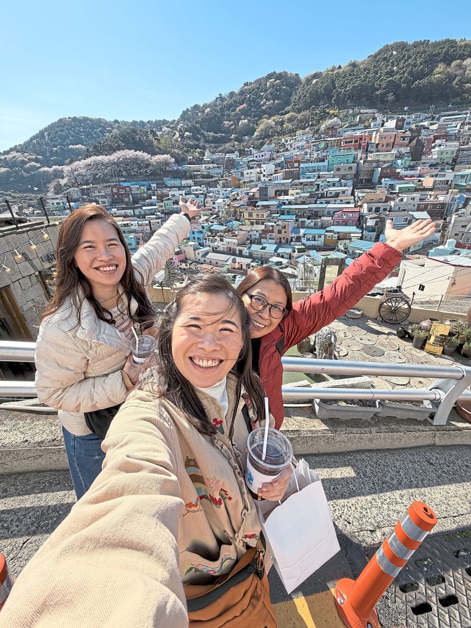 Koh (left) with her twin sister and their mother on a recent trip to South Korea. — FELICIA KOH