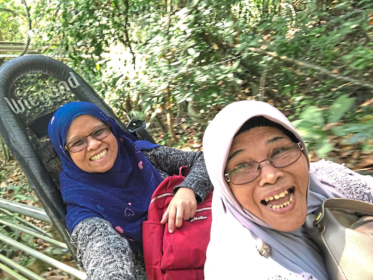 Nor Fadzlina (left) is happy to share her adventures with her mother. — NOR FADZLINA ABD RAHMAN