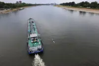Water levels on river Rhine in Germany rising after rain but vessels still part loaded