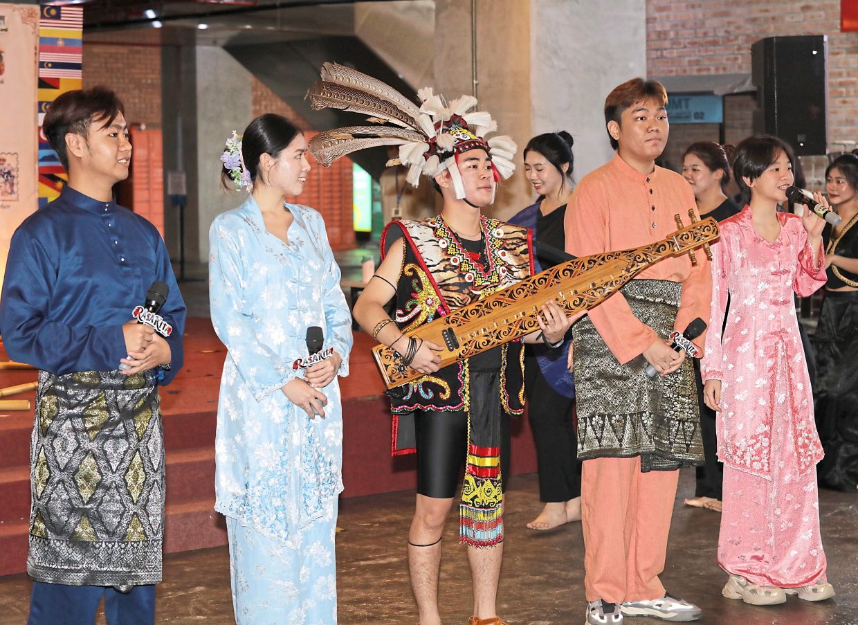 Sape Boy (third left) is an Orang Ulu musician from Sarawak.
