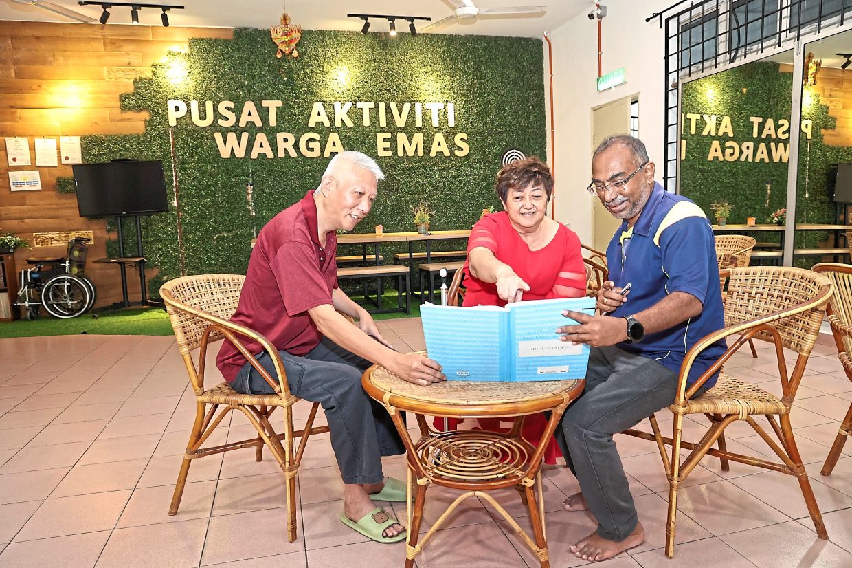 Yeap (centre) keeps herself busy organising activities and bringing residents together.