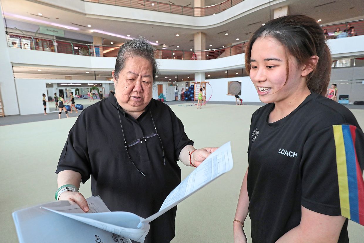Low (left) pursuing her lifelong passion in working with children.