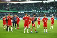 Soccer-Bayern scrape win despite Kane penalty miss after Champions League exit