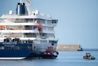 Passengers disembarking from hantavirus-stricken ship in Spain's Canary Islands