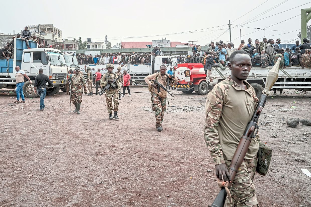 A file photo showing the M23 rebel forces, foreground, last year in Goma, Congo, as they captured and secured Congolese soldiers, on Jan 30, 2025. — Guerchom Ndebo/The New York Times