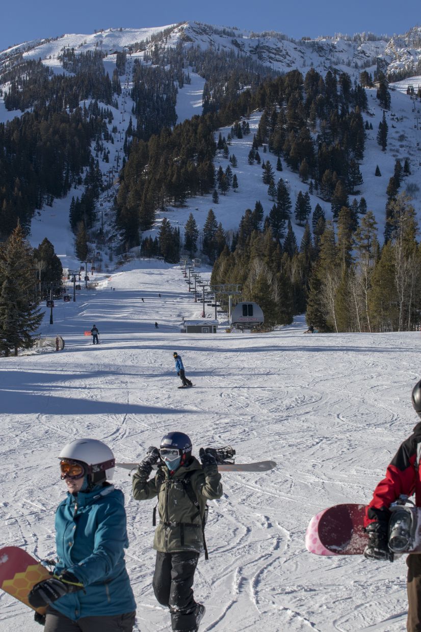 Snowboarders and skiers at Jackson Hole Mountain Resort, which has had an avalanche dog program since 1979.