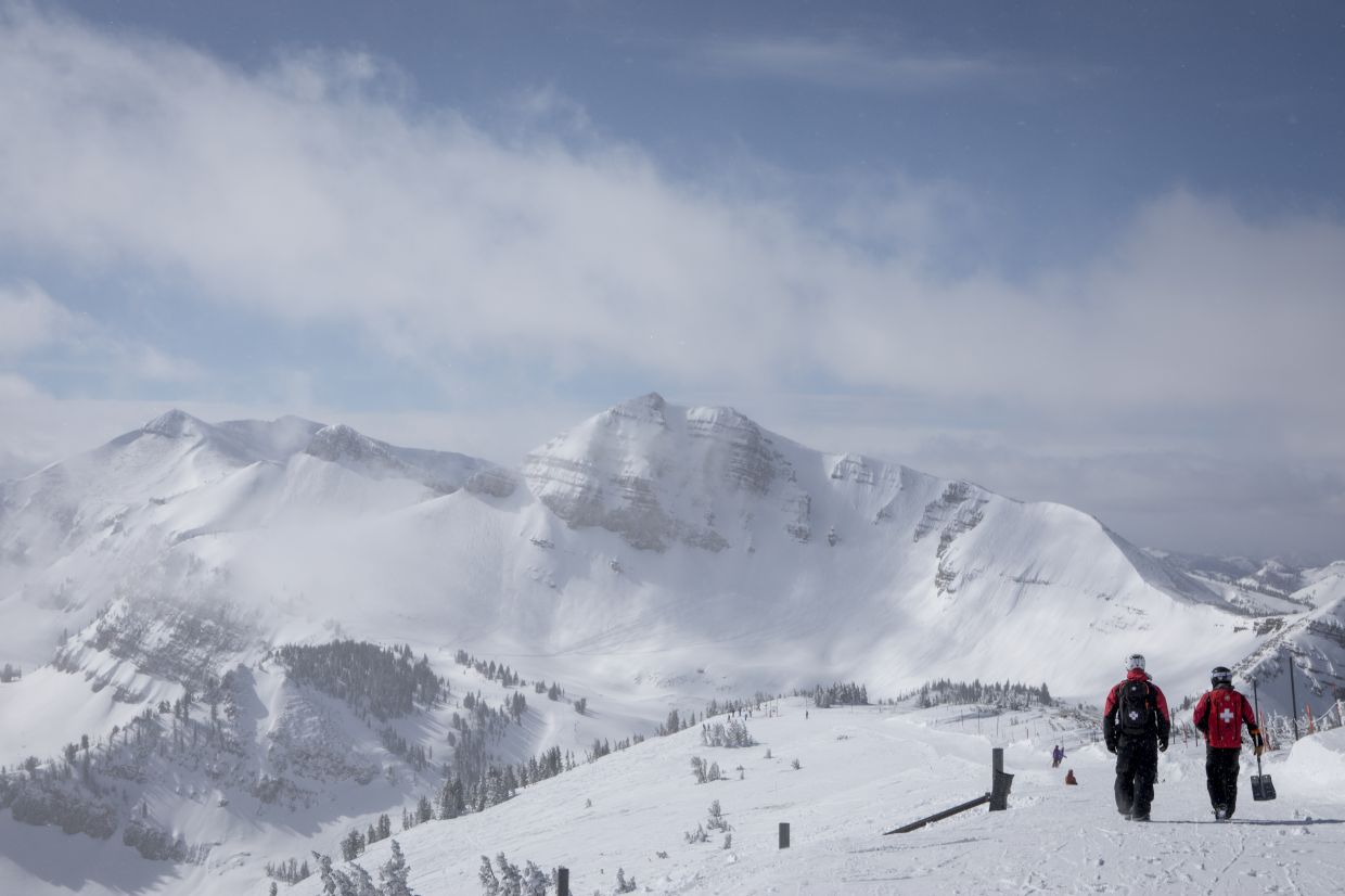 Ski patroller Rob Brennan and Rob Denton walk together at Jackson Hole Mountain Resort.