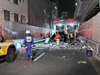 Wall of four-storey building collapses in Osaka, hits taxi, causes minor injuries to female passenger