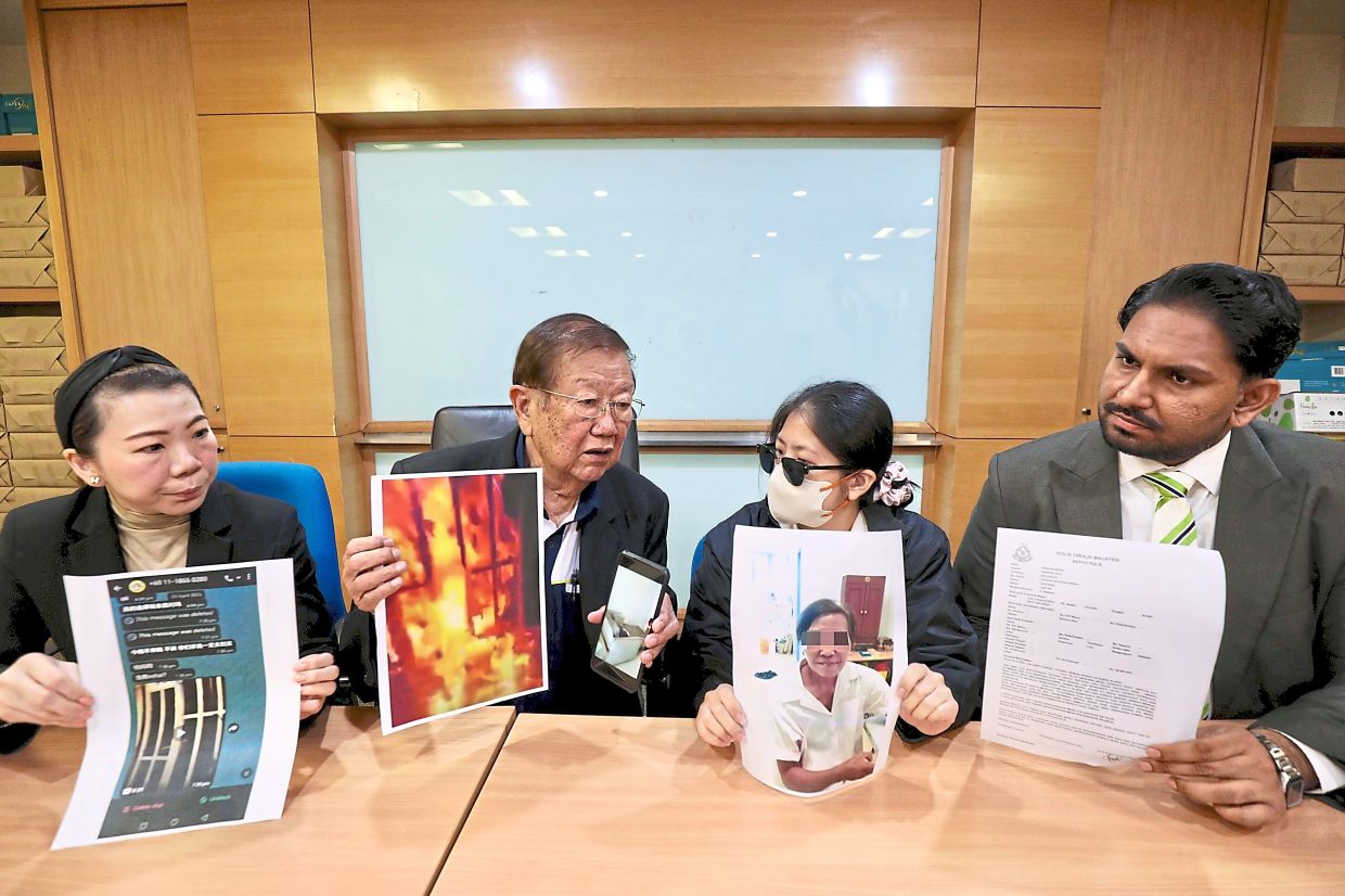 Untenable situation: Lim (second from right) showing a photo of the tenant during the press conference. With her are (from left) lawyer Esther Hor, Chong and lawyer Arun Ganesh Boopalan. — LEONG WAI YEE/The Star