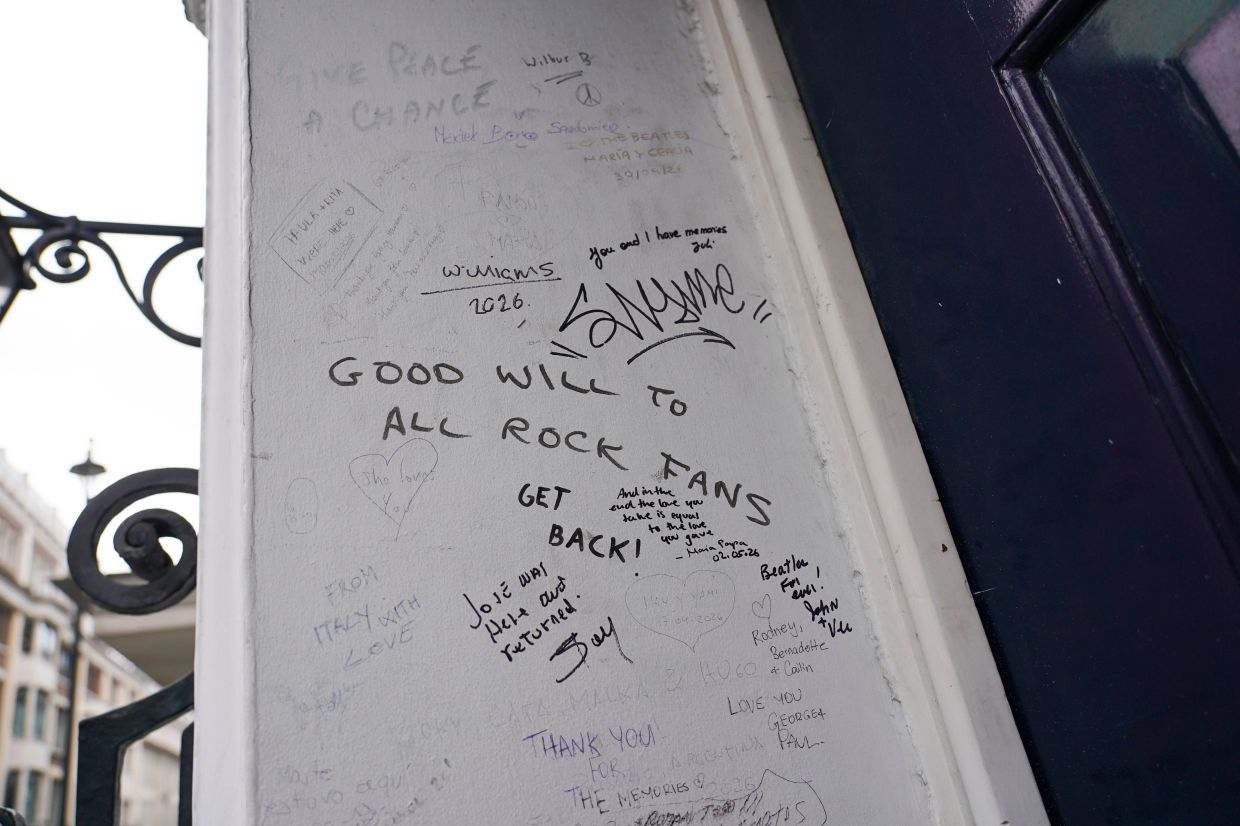 A view of messages on the wall of the building in London where The Beatles held its last ever concert as a band. Photo: AP 