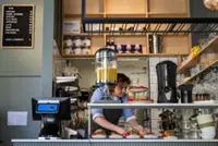 The barista is human but an AI agent runs this experimental Swedish cafe