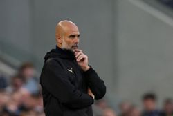 Soccer-No added pressure on Man City due to Arsenal win, Guardiola says