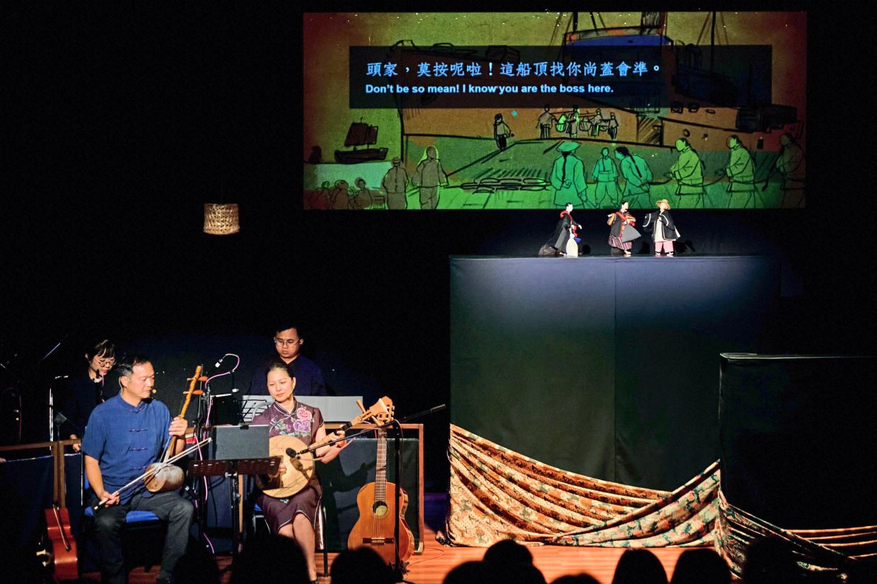 Smile Folksong Group (left foreground) performing with Ombak Potehi. — Handout