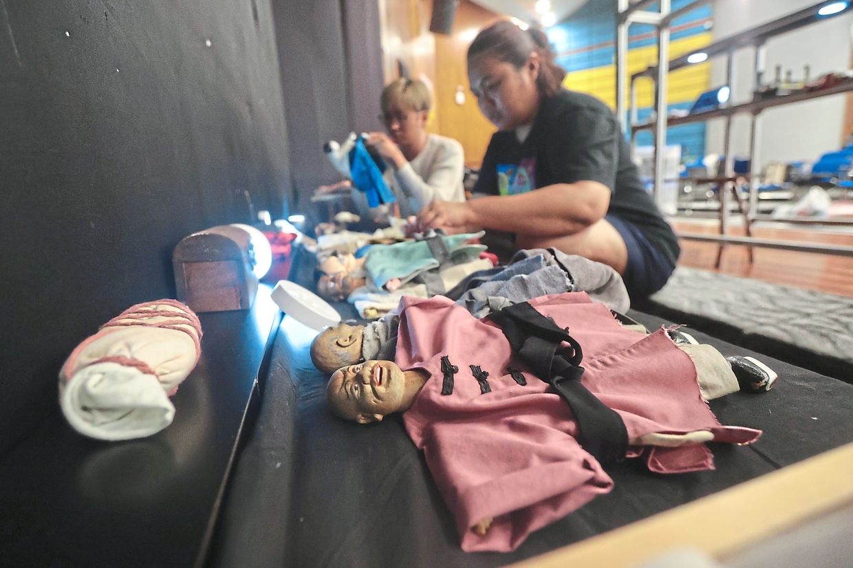 Glove puppets being prepared for rehearsal.