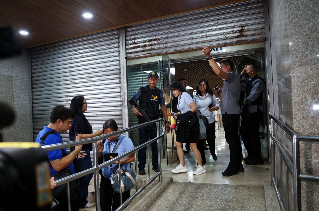 Senate security personnel and police officers work at the site, after gunshots were heard at the Philippine Senate, as chaos mounted in anticipation of an attempt to arrest a top senator wanted by the International Criminal Court, in Pasay City, Metro Manila, Philippines, May 13, 2026. - Photo: Reuters