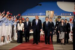 Trump arrives in China for superpower summit with Xi
