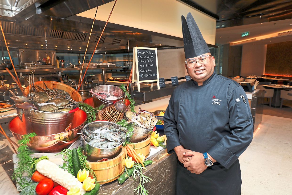 Dennie at the live cooking station with premium crustaceans. 