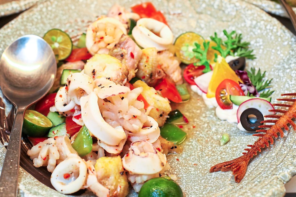Italian seafood salad with fresh basil and rustic buffalo mozzarella. 
