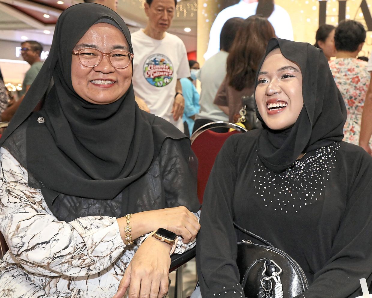 Dhia Irdina sharing a light moment with her mother Kertina.