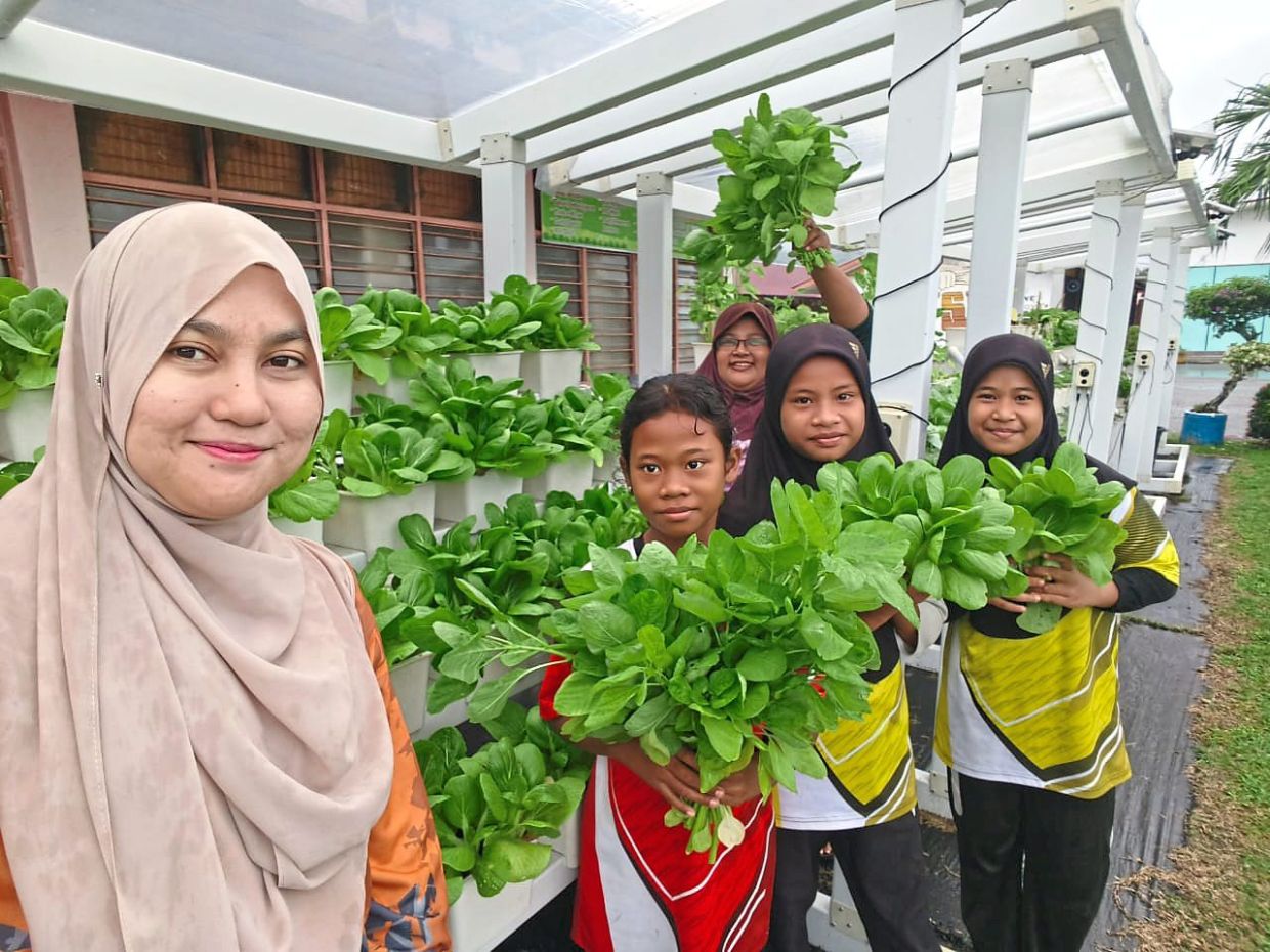 Nur Shafura (left) sees her students being more responsible and disciplined after implementing the project. Photo: Nur Shafura Ramli