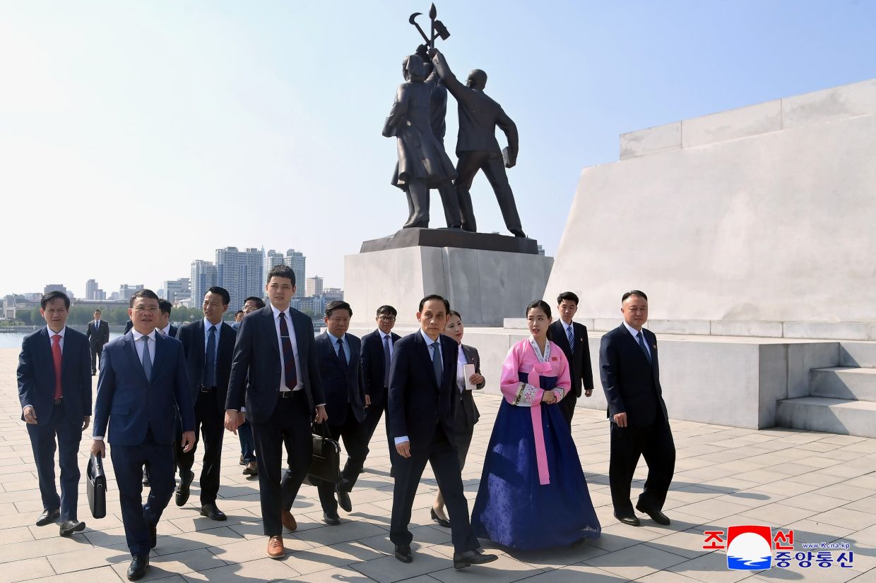 In this photo provided Friday, May 15, 2026, by the North Korean government, Vietnam's Foreign Minister Le Hoai Trung (centre) and his delegates visit the Tower of Juche Idea in Pyongyang, North Korea. Independent journalists were not given access to cover the event depicted in this image distributed by the North Korean government. -- Photo: Korean Central News Agency/Korea News Service via AP