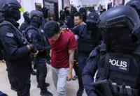 Gang members charged in Kuching under heavy guard