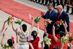 Trump and Xi set for second day of talks after Taiwan warning