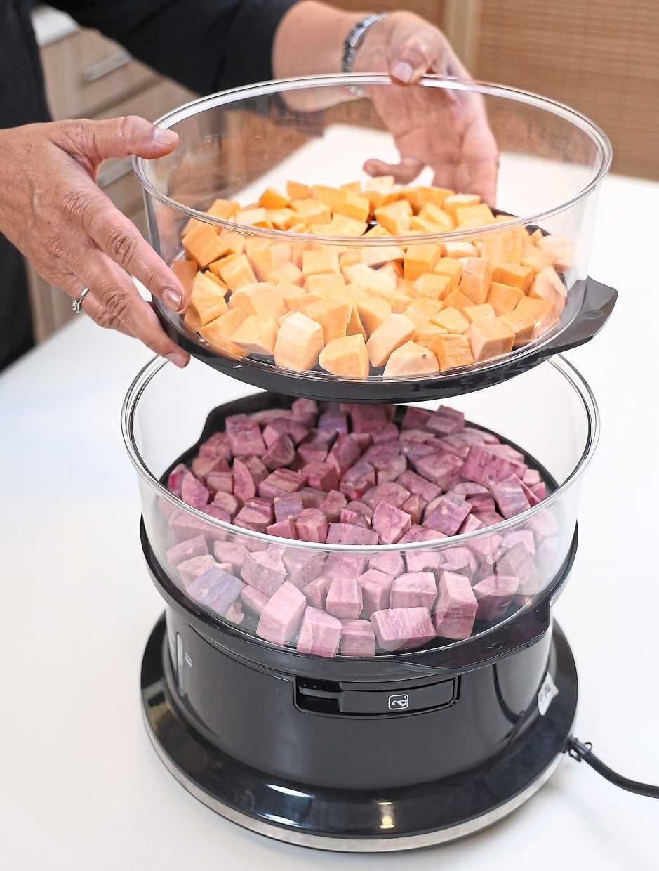 Place the orange and purple sweet potatoes in separate steaming trays to keep the colours separate.
