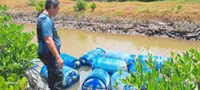 18 drums of petrol found floating in river