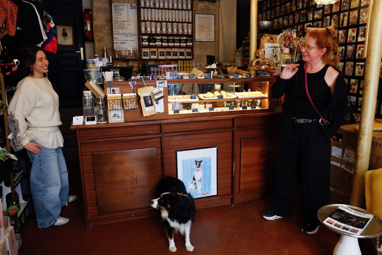 Owner of 'Le Bone Appart' Rebecca Anhalt (right) speaks with a member of her staff.