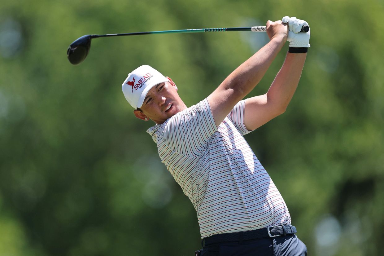 Rico Hoey of the Philippines hits a tee shot on the second hole during the third round of the PGA Championship at Aronimink Golf Club in Newtown, Pennsylvania. -- Photo: Photo by Michael Reaves / GETTY IMAGES via AFP