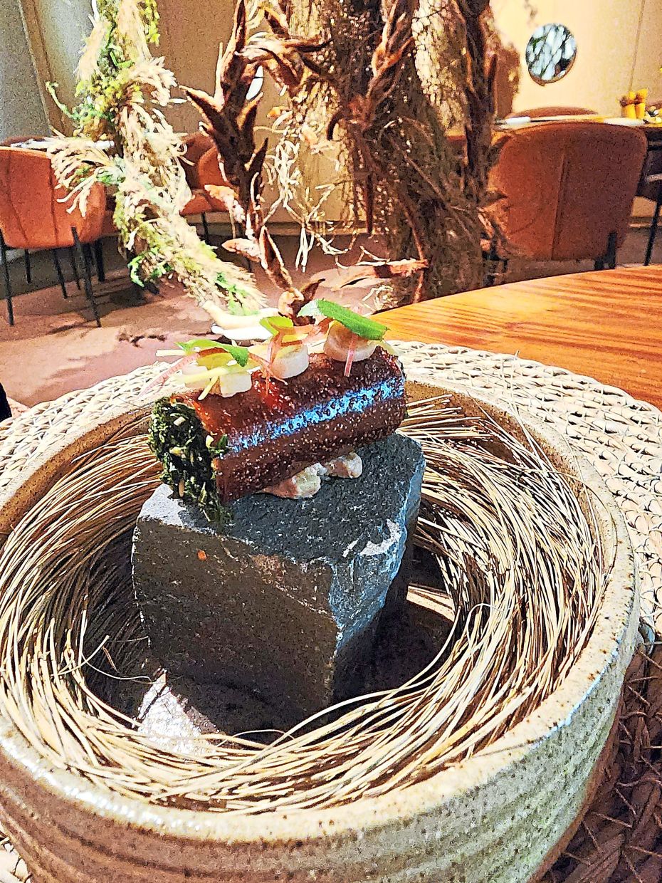 This reconfiguration of the ayam masak pansuh features a crisp tuile, chicken liver pate, tuhau and bunga kantan in starring roles.