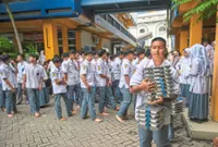 Hundreds of Surabaya students fall ill after consuming free meals