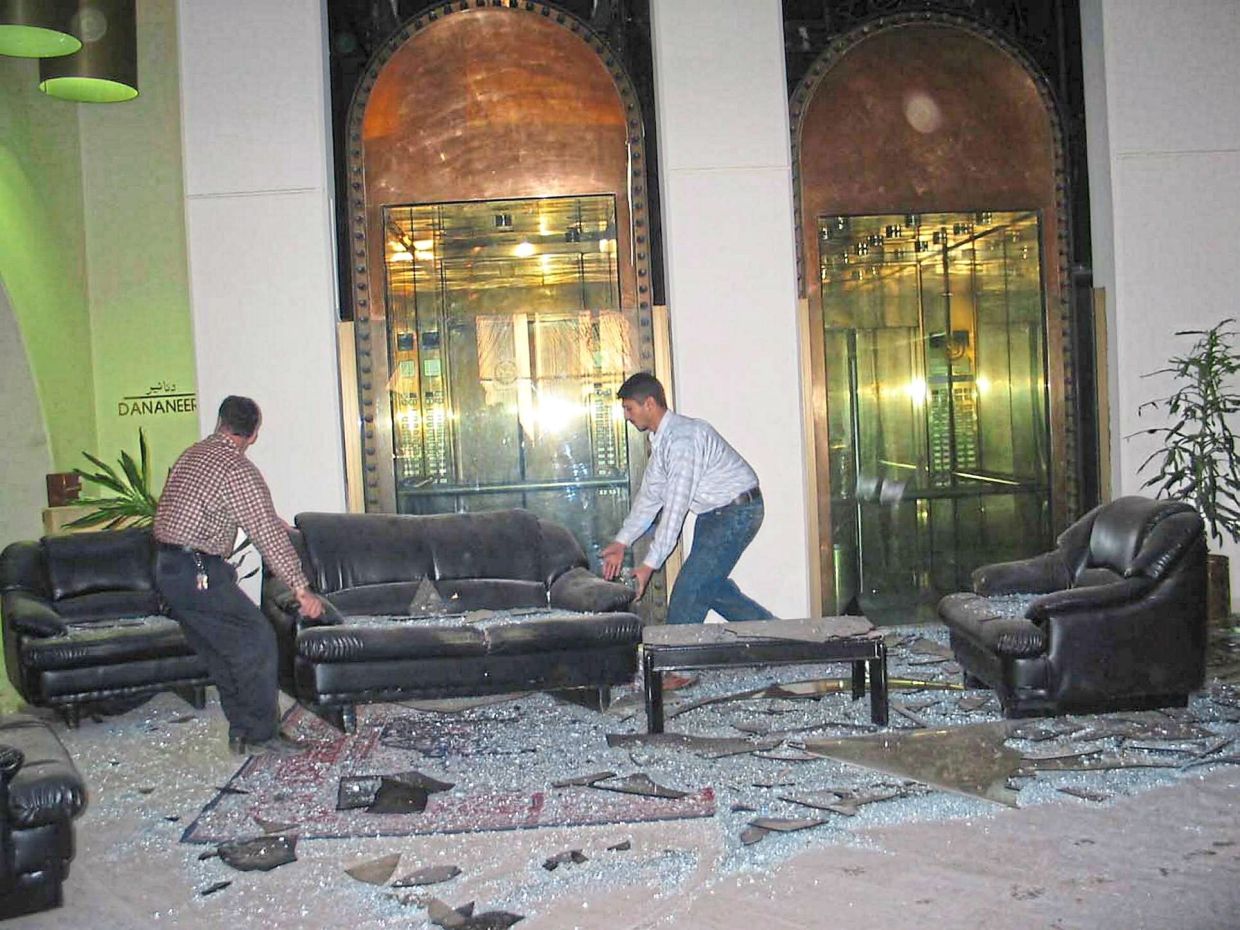 Hotel staff clearing debris in the lobby after the hotel Shahanaaz was staying in was struck by a missile. — SHAHANAAZ HABIB/The Star