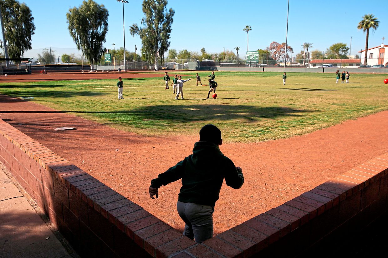 Students play ball during recess at the St. Agnes Elementary School in Phoenix, Arizona. Photo: AP