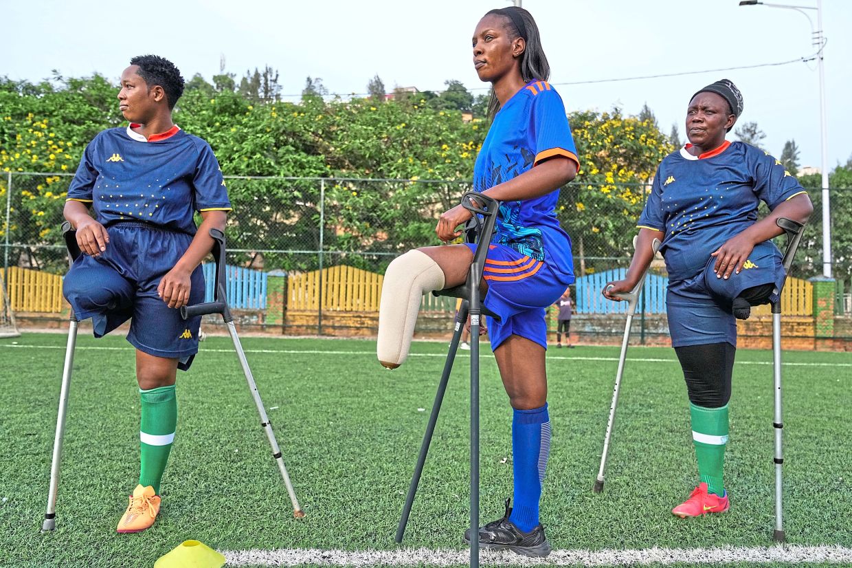 Some players are victims of genocide, while others are survivors of road accidents or illness. Photo: AFP