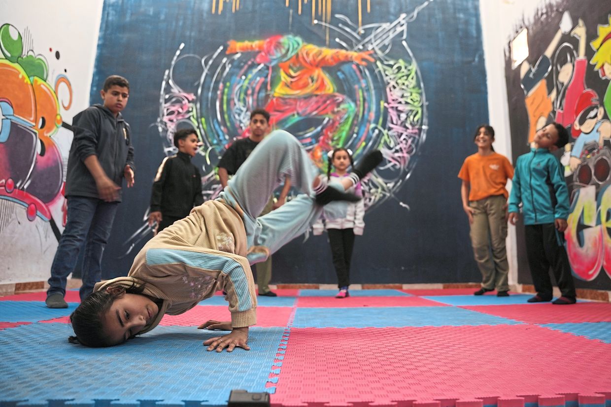 The programme helps builds the children's self confidence and improve their mental health through break dance, gymnastics, and contemporary dance. Photo: AP