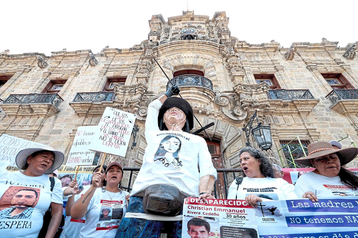 Mothers searching for their missing children chanting slogans during a Mothers Day protest in Guadalajara, Jalisco state, Mexico. — AFP