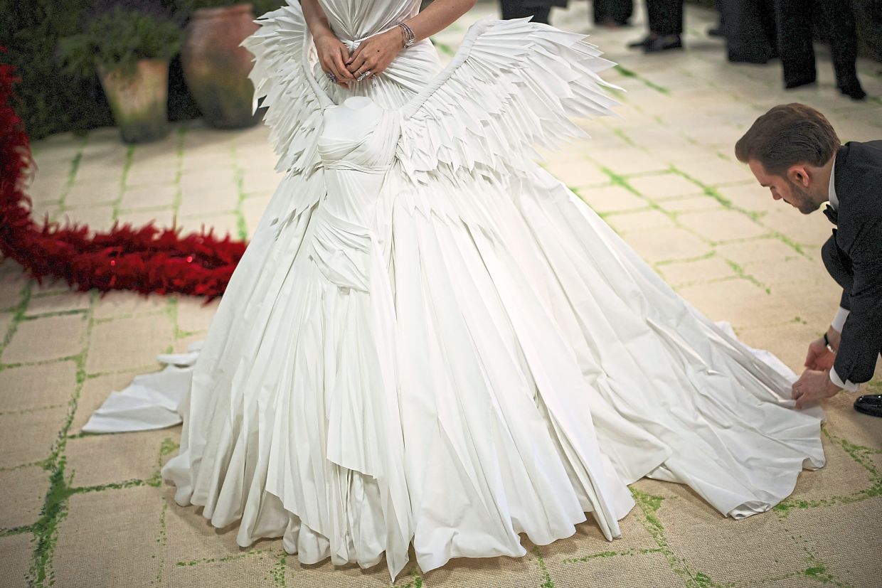 Tech investor and entrepreneur Yu-chi Lyra Kuo turned heads in a striking custom pure-white gown crafted by the Jean Paul Gaultier haute couture atelier. The sculptural look drew inspiration from the iconic ‘Winged Victory of Samothrace’, the ancient Greek marble masterpiece housed in the Louvre Museum.— Reuters
