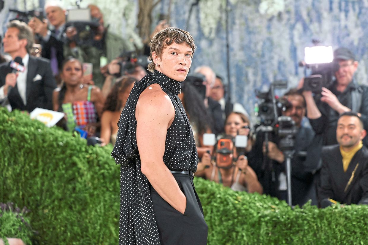 US star Connor Storrie made his debut on the 2026 Met Gala red carpet in a striking look by Anthony Vaccarellofor Yves Saint Laurent, featuring an extra-long Lavalliere top in polka-dotted silk muslin paired with sharply tailored high-rise trousers. — AFP