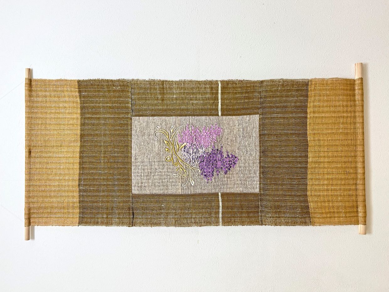 Afiza's 'Cascading Into Existence' (2026), made from wool, linen, cotton, metallic polyester threads and wood.