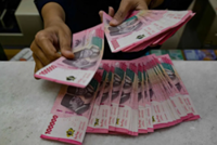 Record low rupiah sparks memes, call for Indonesian bank official to resign