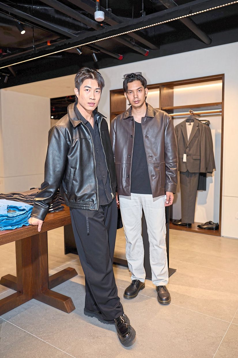 Malaysian celebrities Thompson Goh (left) and Azim Yusof attend a boutique relaunch in Kuala Lumpur. The local fashion scene reflects broader global headwinds. Photo: Zara