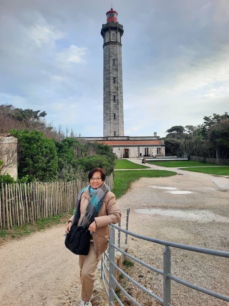 The writer at a lighthouse in Ile de Re, La Rochelle, France in December 2025.