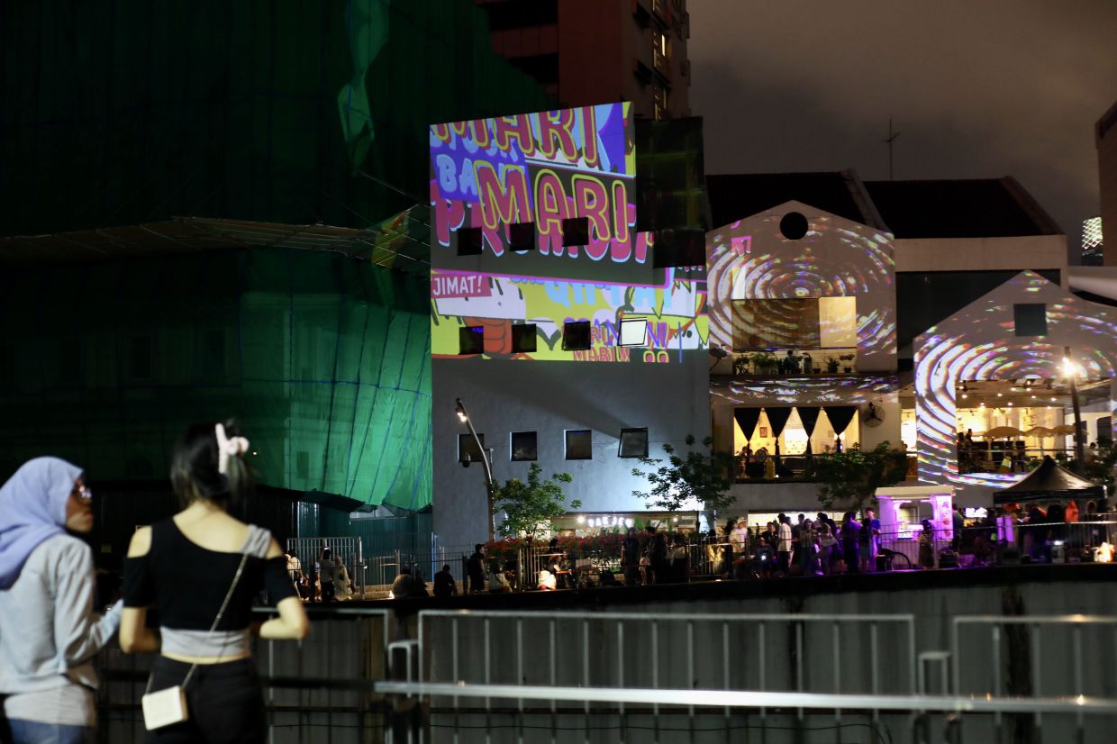 A view of the projection mapping displays from KL Festival’s recent 'Warung Terang' series in downtown Kuala Lumpur. This Saturday’s 'Cantonese Opera By The River Of Life' live performance in the same area is expected to draw a large crowd. Photo: The Star/Leong Wai Yee 